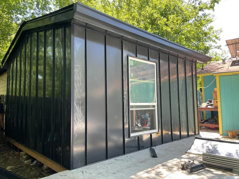 Black standing seam metal wall panels for Roof Inspection in Cherry Hills Village