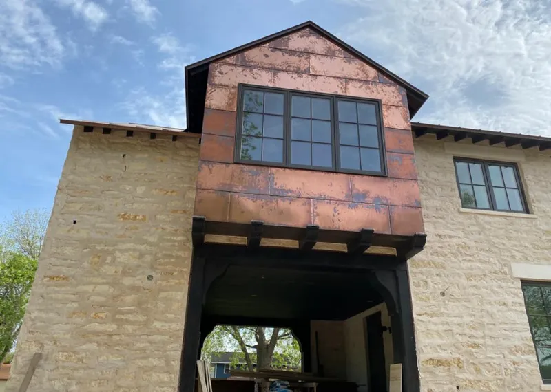 Copper metal panel facade on a stone building for Skylight Installation in Cherry Hills Village
